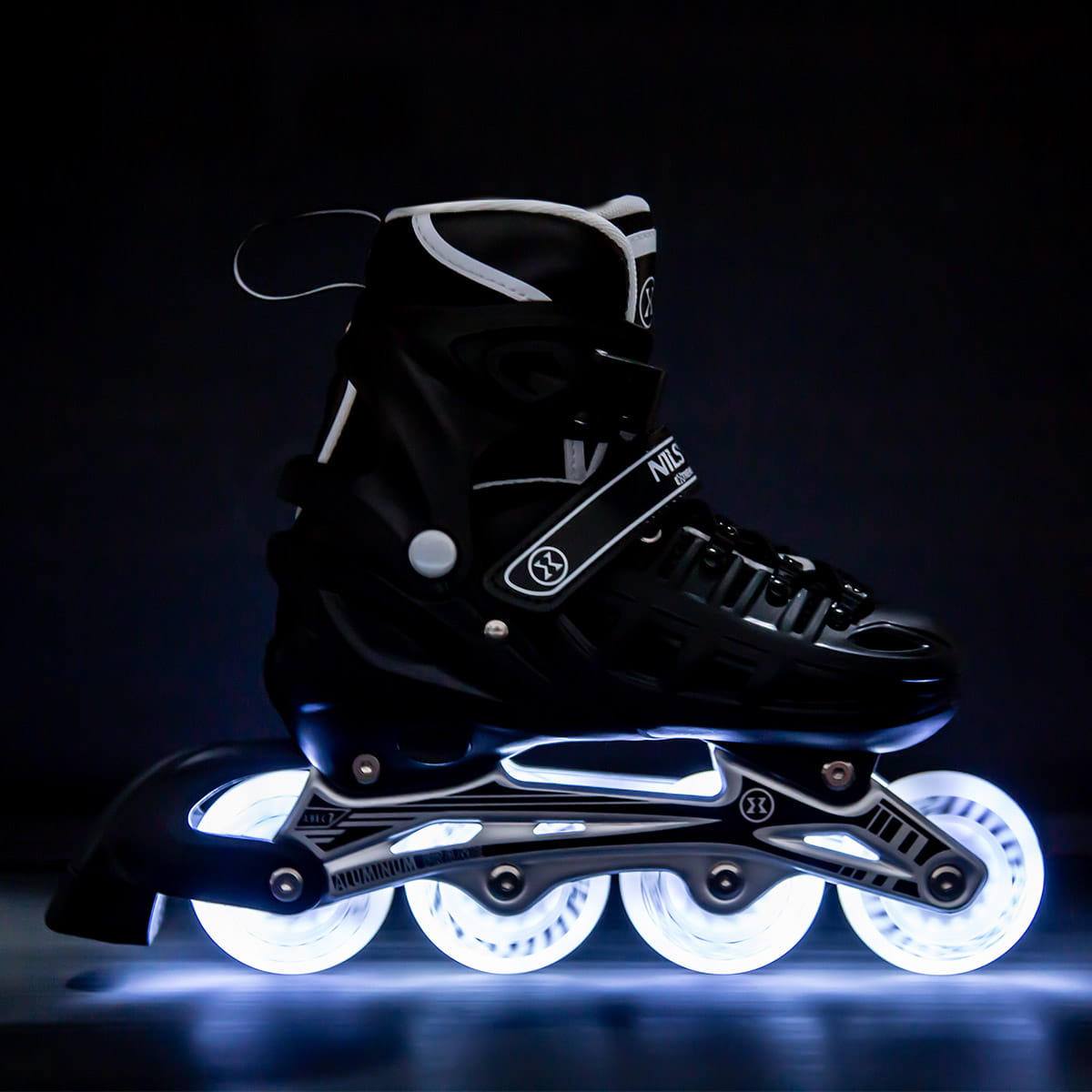 ŁYŻWOROLKI Z WYM. PŁOZĄ HOKEJOWĄ NH10905 4w1 CZARNE LED NILS EXTREME